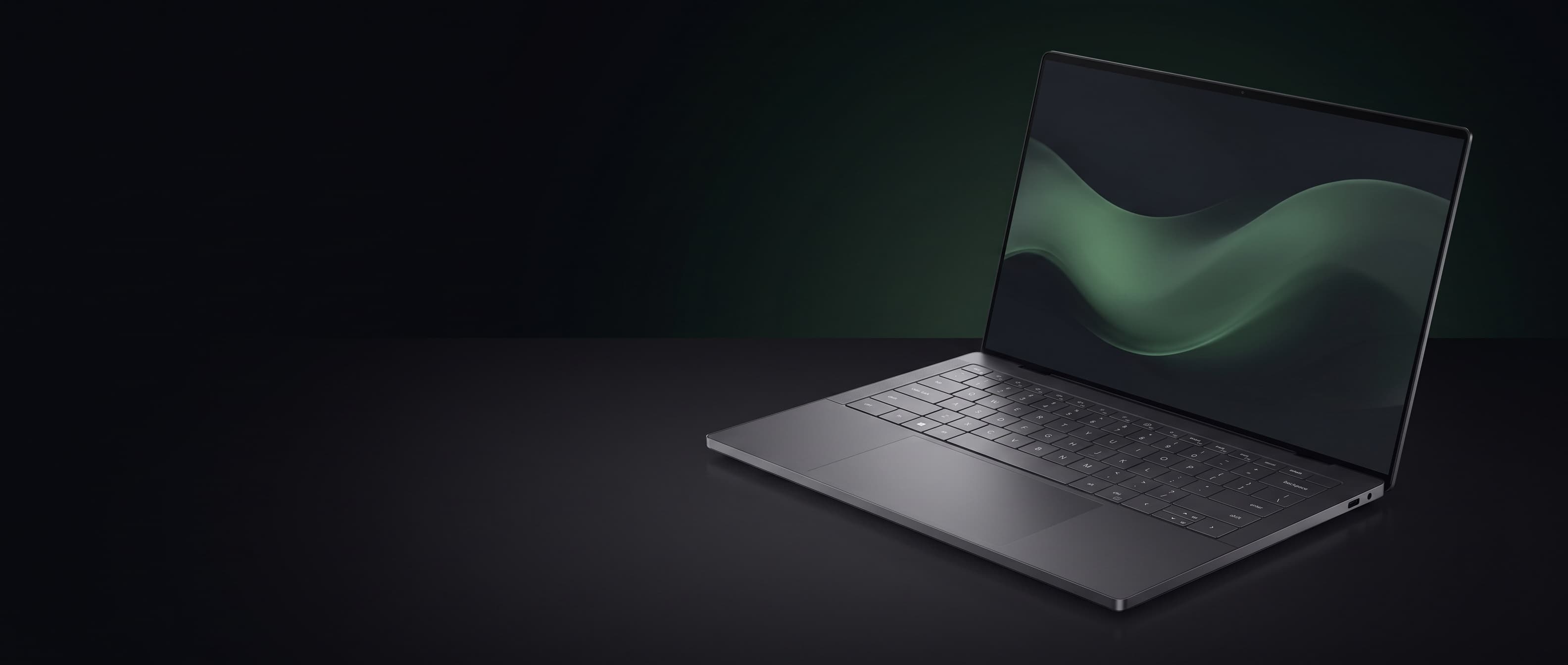 Smukły ultrabook Dell XPS na ciemnej matowej powierzchni