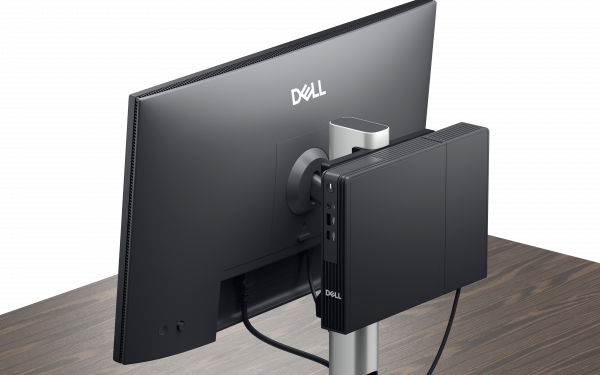 Obraz komputera Dell Pro Micro zamontowanego z tyłu podstawy monitora.